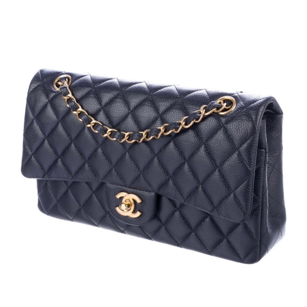 Chanel caviar medium double flap gold hardware in dark navy.